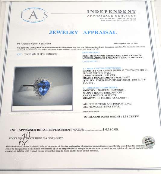 Shimmering 2.31CT Tanzanite & Diamond Ring in 18KT White Gold