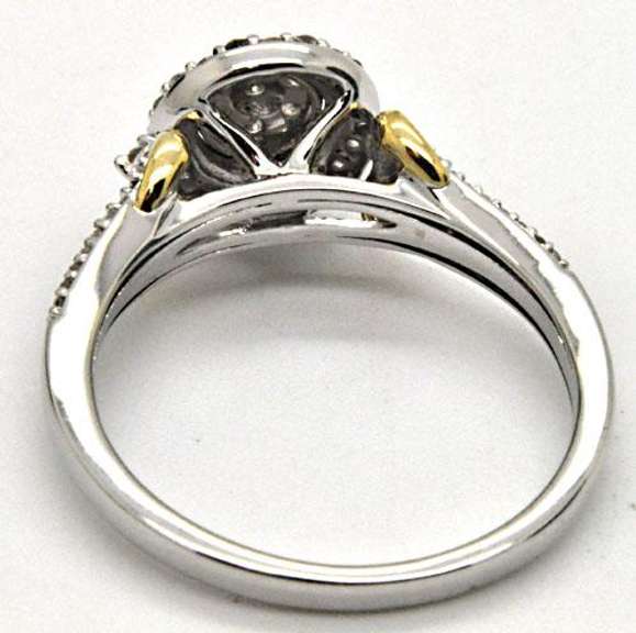 14KT WHITE GOLD DIAMOND RING WITH YELLOW GOLD ACCENTS.