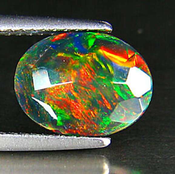 Captivating 1.44ct floral and fairy fire black Opal