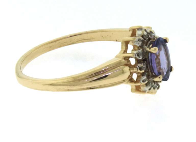 Amazing Yellow Gold Oval Tanzanite and Diamond Halo Ring