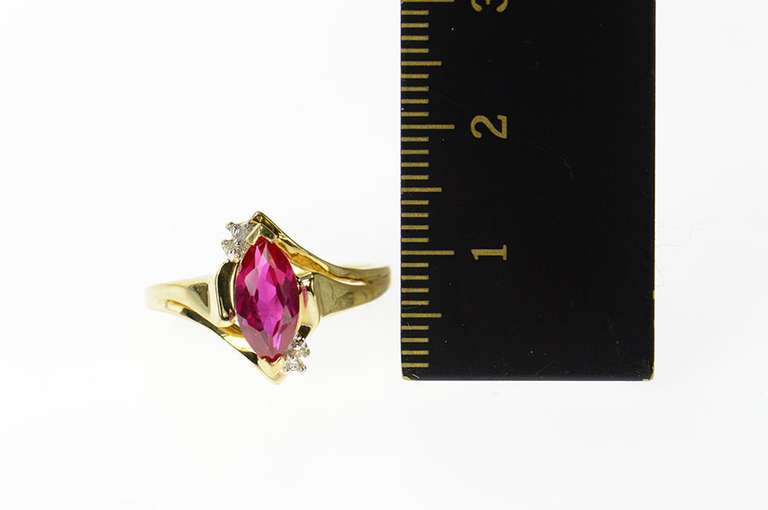 10K Yellow Gold Diamond Accent Marquise Syn. Ruby Bypass Ring