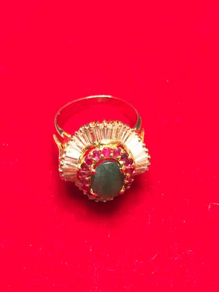 18k yellow gold ladies emerald rubies and diamond ballerina ring.