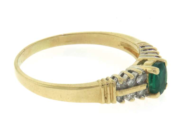 Fantastic Oval Cut Emerald & 2 Row Diamond Side Ring