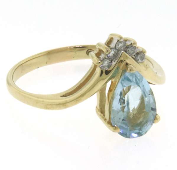 Wonderful Yellow Gold Pear Blue Topaz and Diamond Ring