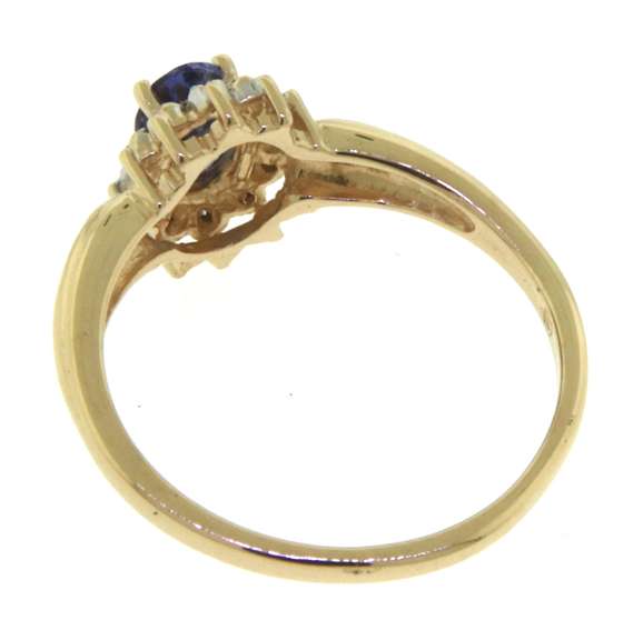 Amazing Yellow Gold Oval Tanzanite and Diamond Halo Ring