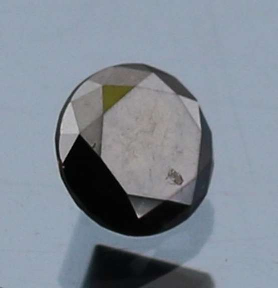 Very fine .54ct smooth cut Black Diamond solitaire