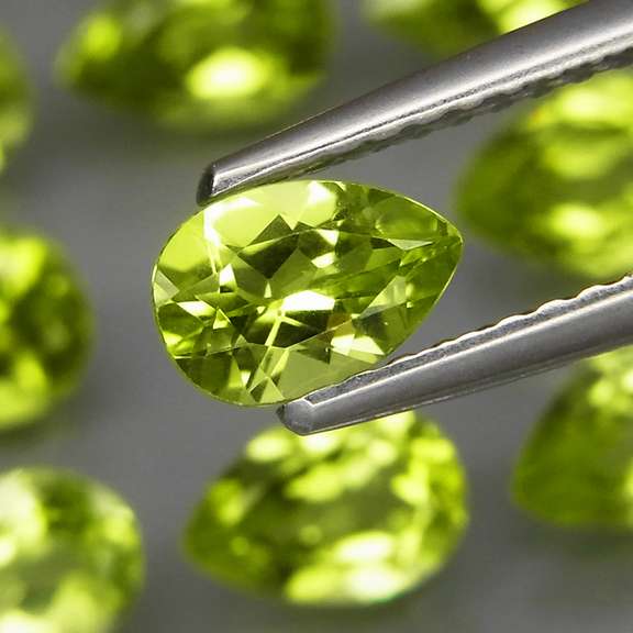 Pear cut! Unheated! 6.91ct Peridot set!