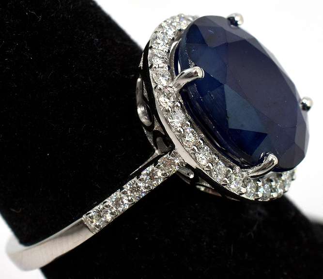 Impressive Sapphire & Diamond Halo Ring in 18KT White Gold