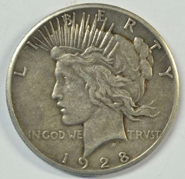 The Rare 1928-P Peace Silver Dollar. Razor-sharp