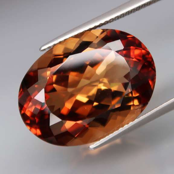 Outstanding 24.77ct eye clean whiskey red Imperial Topaz