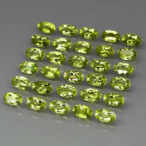 Real 7.55ct untreated apple green Peridot set
