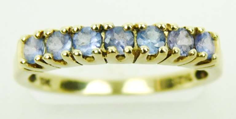 10K Band of 7 Round Tanzanites, Size 7