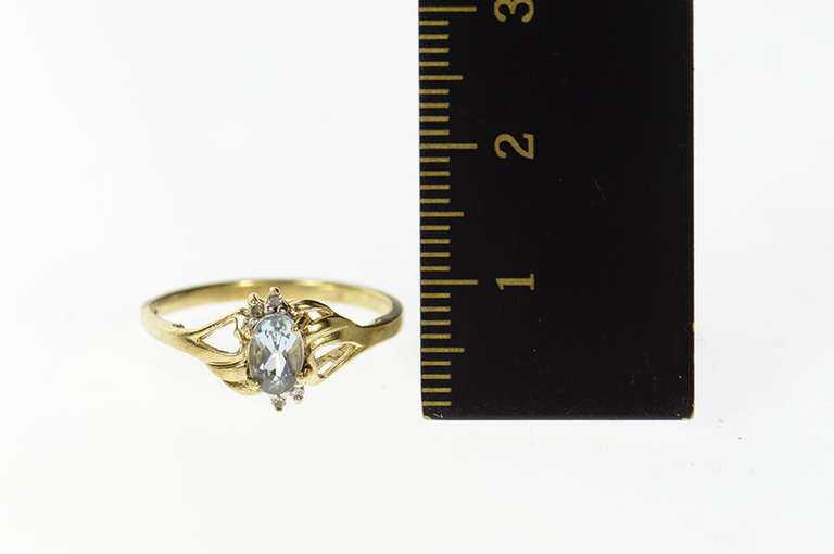 10K Yellow Gold Oval Blue Topaz Diamond Bypass Ring