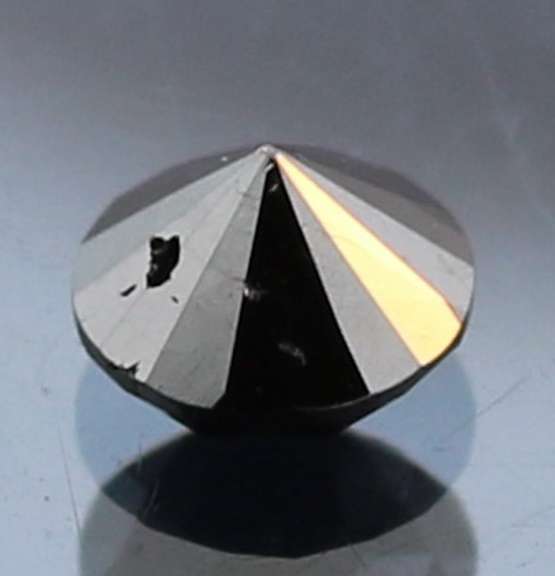 Very fine .93ct smooth cut Black Diamond solitaire