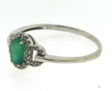 Charming Oval Emerald and Diamond Halo Ring