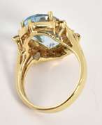 Intriqueing Blue Topaz and Diamond Ring