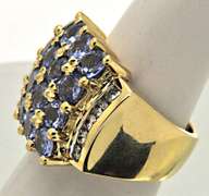 14K YELLOW GOLD TANZANITE AND DIAMOND RING.