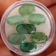 Heavy emerald green 12.21ct 7pc emerald set
