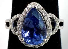 Entrancing 4.62CT Tanzanite & Diamond Ring in 18KT White Gold