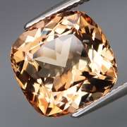 Stunning 9.74ct eye clean golden peach Topaz