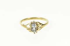 10K Yellow Gold Oval Blue Topaz Diamond Bypass Ring