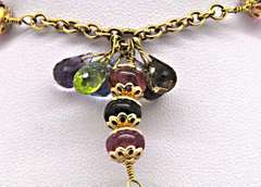 18KT YELLOW GOLD MIXED GEMSTONE BRIOLETTE NECKLACE.
