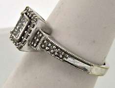 VERY CLASSY 10KT WHITE GOLD LADIES DIAMOND RING.
