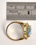 Intriqueing Blue Topaz and Diamond Ring