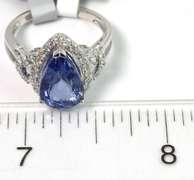 Entrancing 4.62CT Tanzanite & Diamond Ring in 18KT White Gold