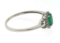 Charming Oval Emerald and Diamond Halo Ring