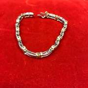 14k white and yellow gold ladies diamond bracelet xo design