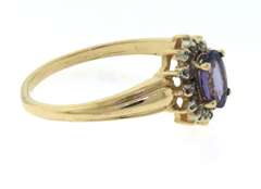 Amazing Yellow Gold Oval Tanzanite and Diamond Halo Ring