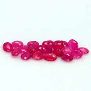 Vibrant 6.65ct oval cut reddish pink Ruby set