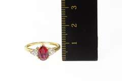 10K Yellow Gold Pear Syn. Garnet CZ Accent Three Stone Ring