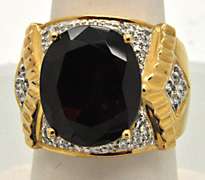 14K YELLOW GOLD GARNET & DIAMOND RING.