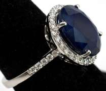 Impressive Sapphire & Diamond Halo Ring in 18KT White Gold