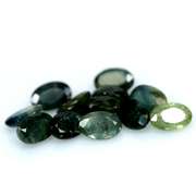 Multi-hue 6.75ct natural blue green Sapphire set