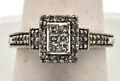VERY CLASSY 10KT WHITE GOLD LADIES DIAMOND RING.