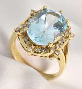 Intriqueing Blue Topaz and Diamond Ring