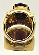 14K YELLOW GOLD GARNET & DIAMOND RING.