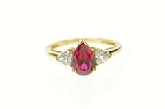 10K Yellow Gold Pear Syn. Garnet CZ Accent Three Stone Ring