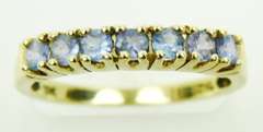 10K Band of 7 Round Tanzanites, Size 7