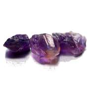 Collectors rich untreated 21.37ct uncut Amethyst set