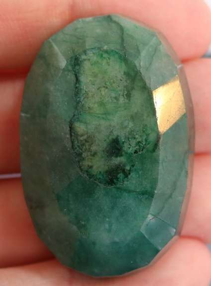 Large 160.5ct oval cut forest green Emerald