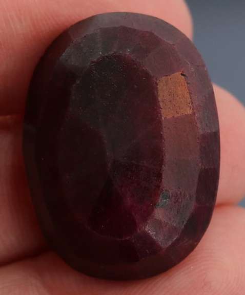 Fiery 66.5ct oval cut deep red Ruby