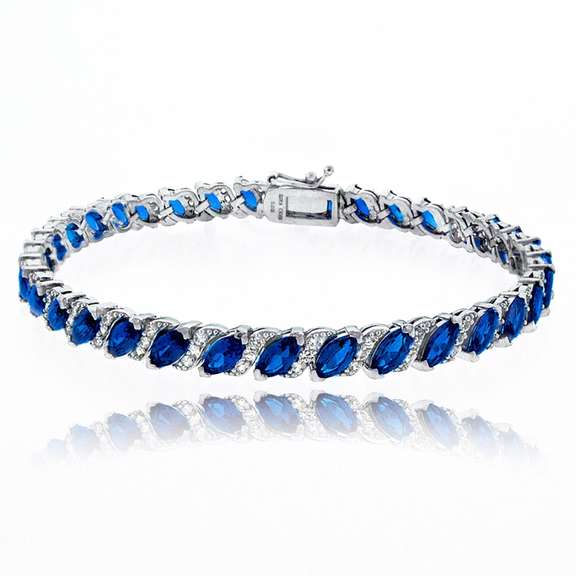 Created Blue Sapphire Tennis Bracelet with White Topaz Accents in 925 Silver