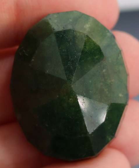 Large 96.5ct oval cut forest green Emerald