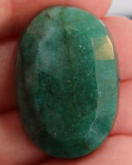 Large 74.5ct oval cut forest green Emerald
