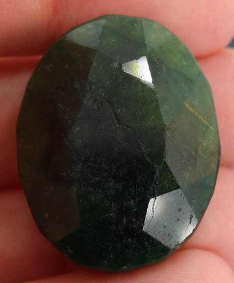 Large 96.5ct oval cut forest green Emerald