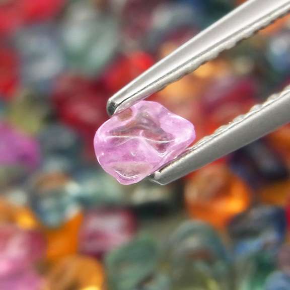 Amazing 24.20ct fancy color unshaped Sapphire set